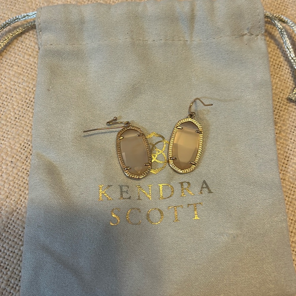 Kendra Scott earrings, rose gold with a peach colored stone, about 1” long